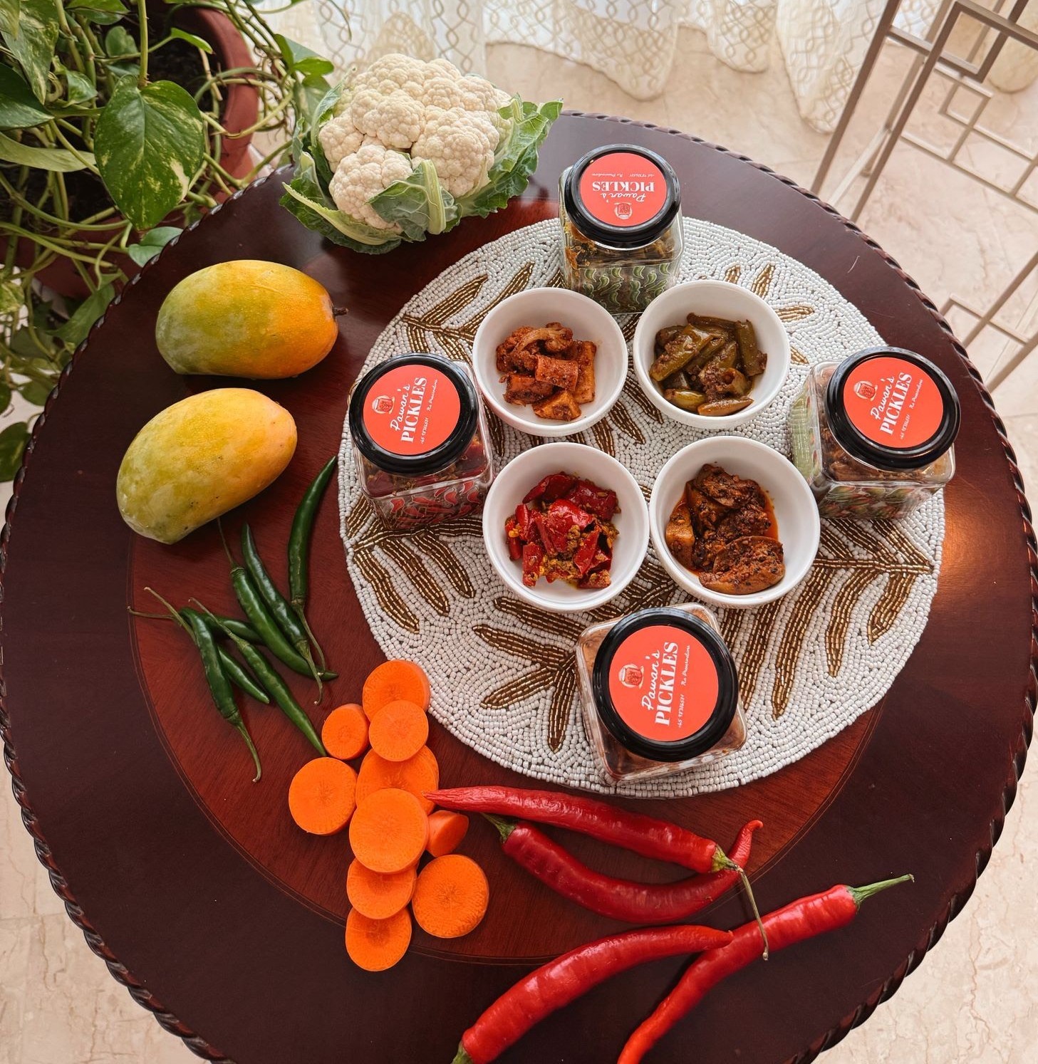 Pawan's Pickles heritage display with fresh ingredients and artisanal jars